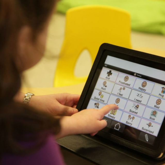 Girl and Proloquo to go