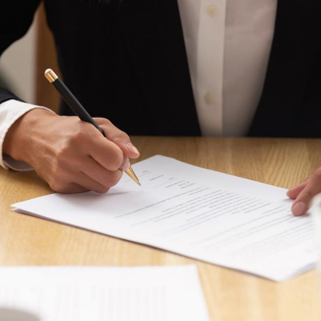 Person signing a document