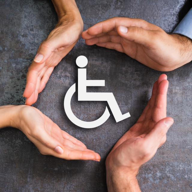 Disability symbol with four hands