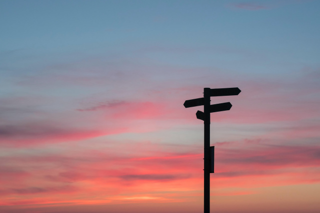 Sign post silhouette with sunset